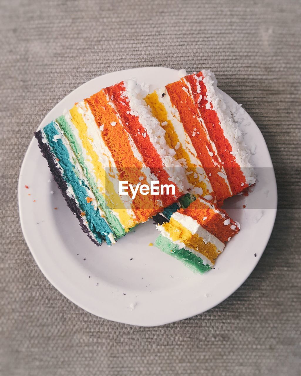 Directly above shot of colorful cake in plate on table