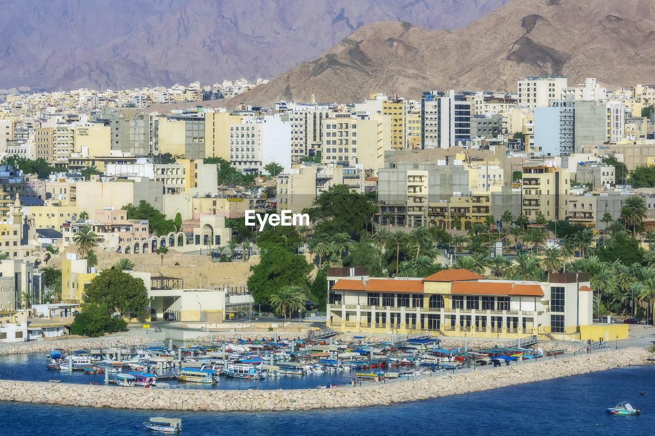 Seaport and buildings at aqaba on sunny day