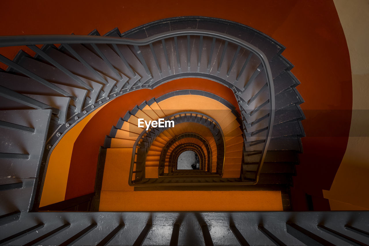 Directly below shot of spiral staircase in building