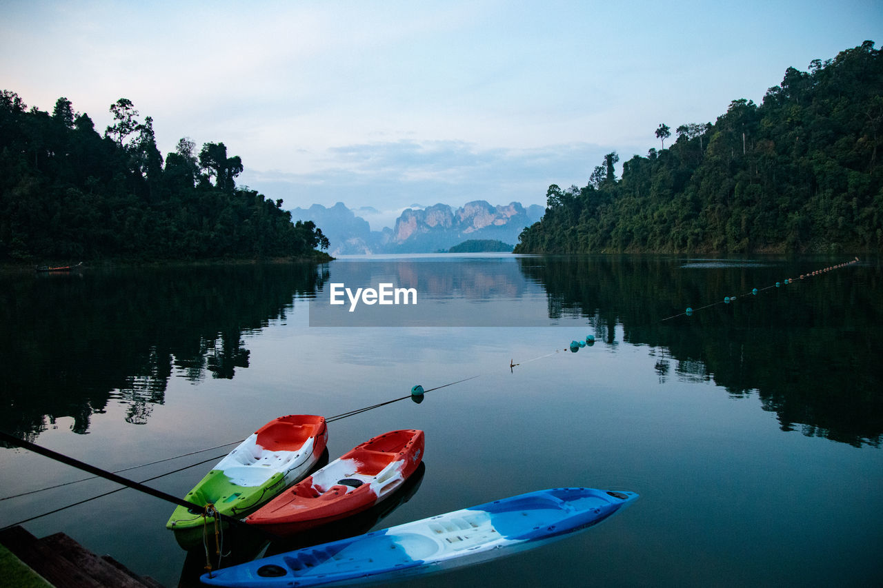 Boat in lake at ratchaprapa dam ,khao sok, surat thani province, thailand 