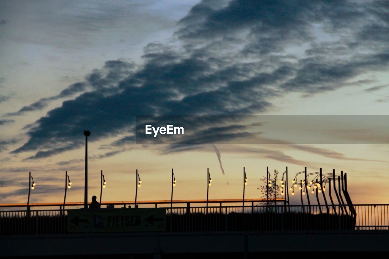 LOW ANGLE VIEW OF SILHOUETTE BRIDGE AGAINST SKY