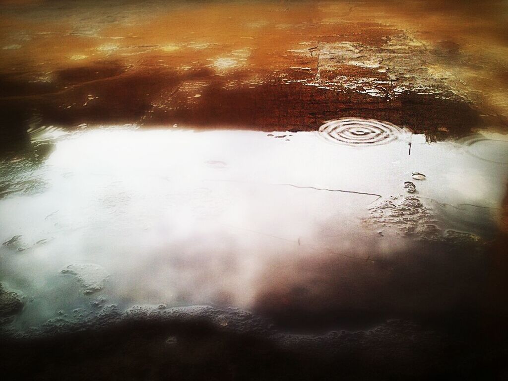 High angle view of puddle on street