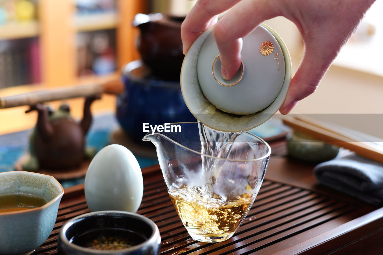 food and drink, hand, meal, food, one person, indoors, drink, breakfast, pouring, brunch, baked, adult, holding, bowl, refreshment, culture, household equipment, egg, business, freshness, lifestyles, close-up, focus on foreground, healthy eating, kitchen, restaurant, cup, dish, wellbeing, domestic room