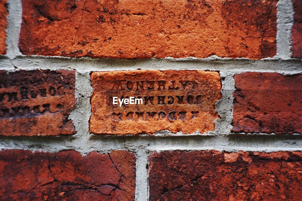 CLOSE-UP OF TEXT ON WALL