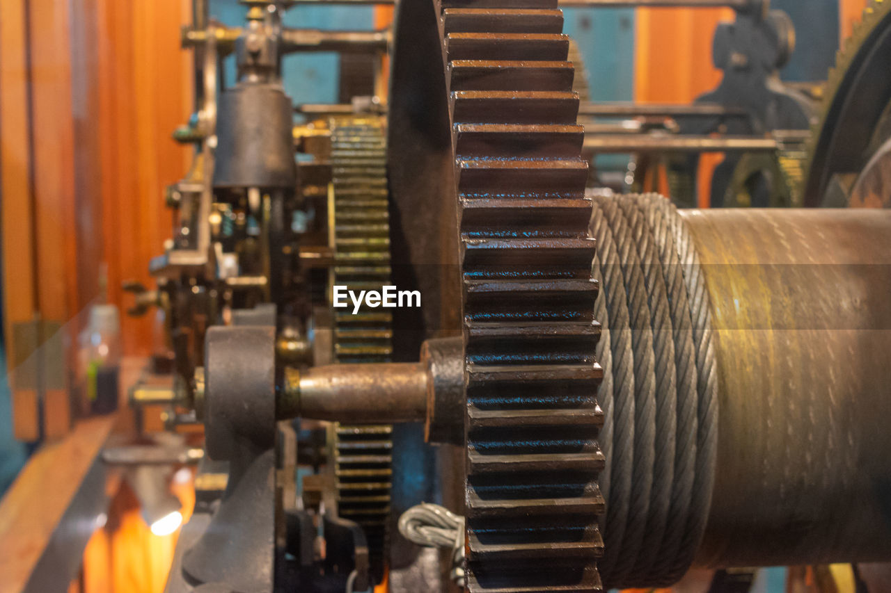 A detail of the tower clock mechanism with gearwheels