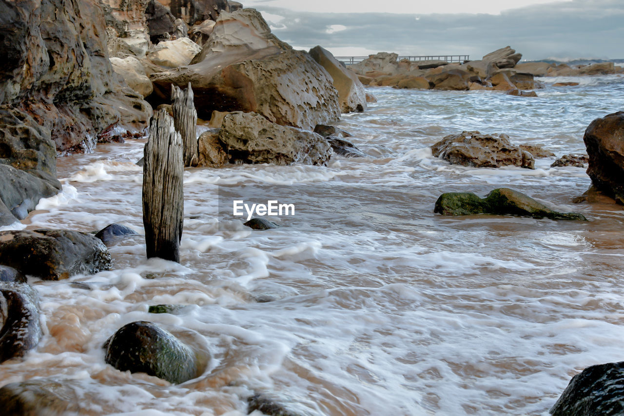 Scenic view of rocks in sea