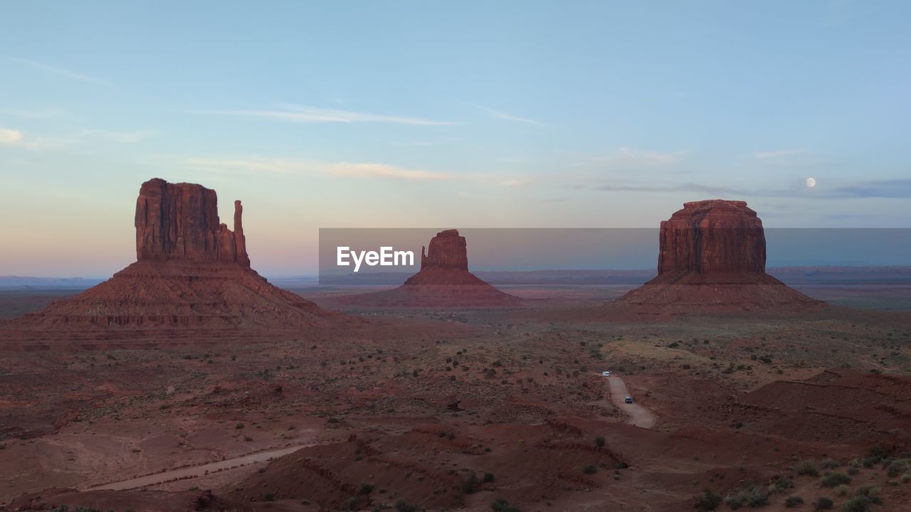 Scenic view of desert against sky during sunset