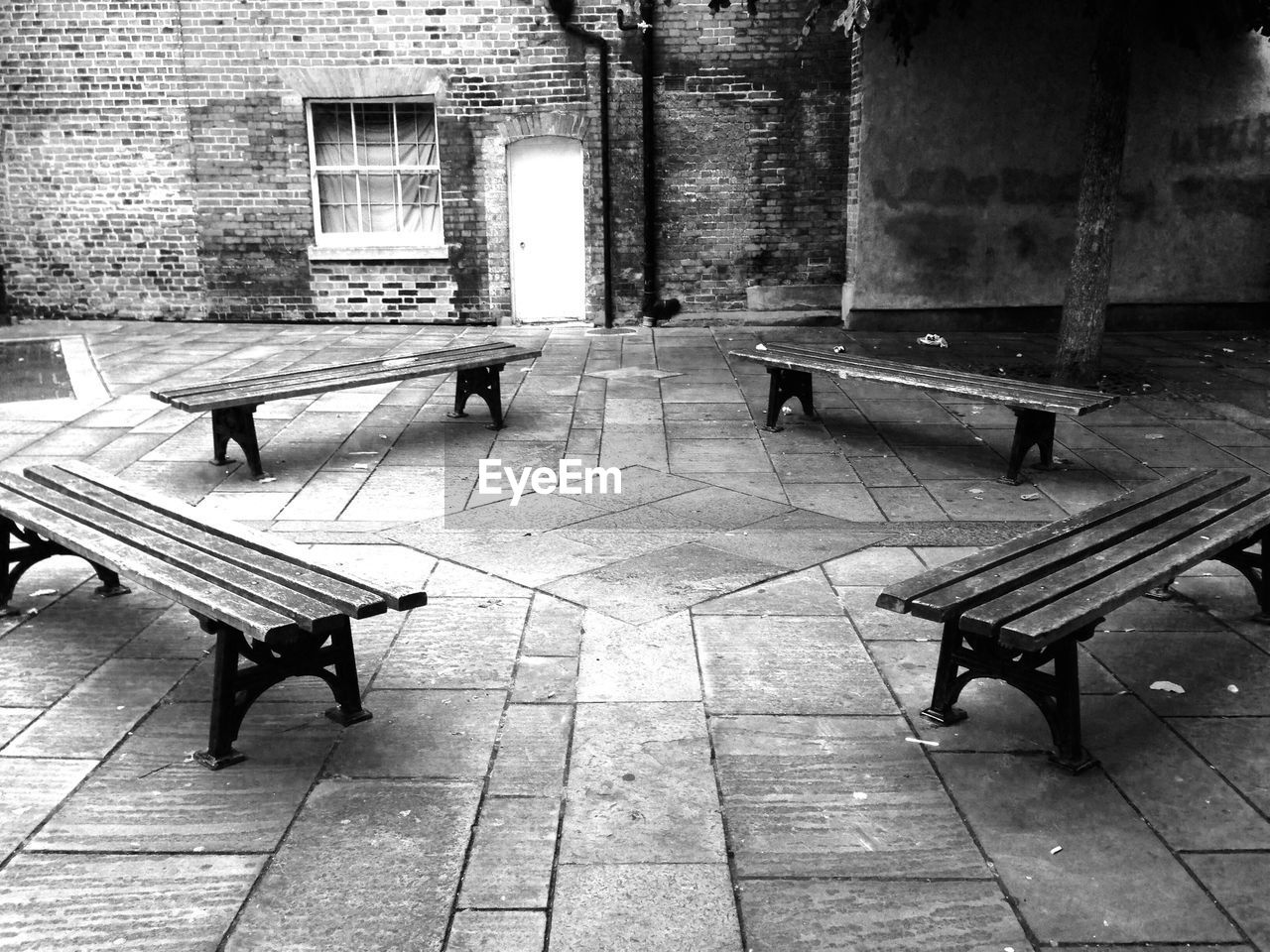 High angle view of benches on footpath