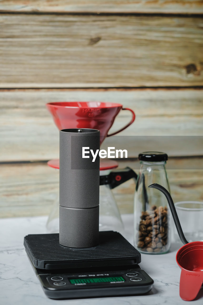 CLOSE-UP OF COFFEE CUP ON TABLE AT HOME