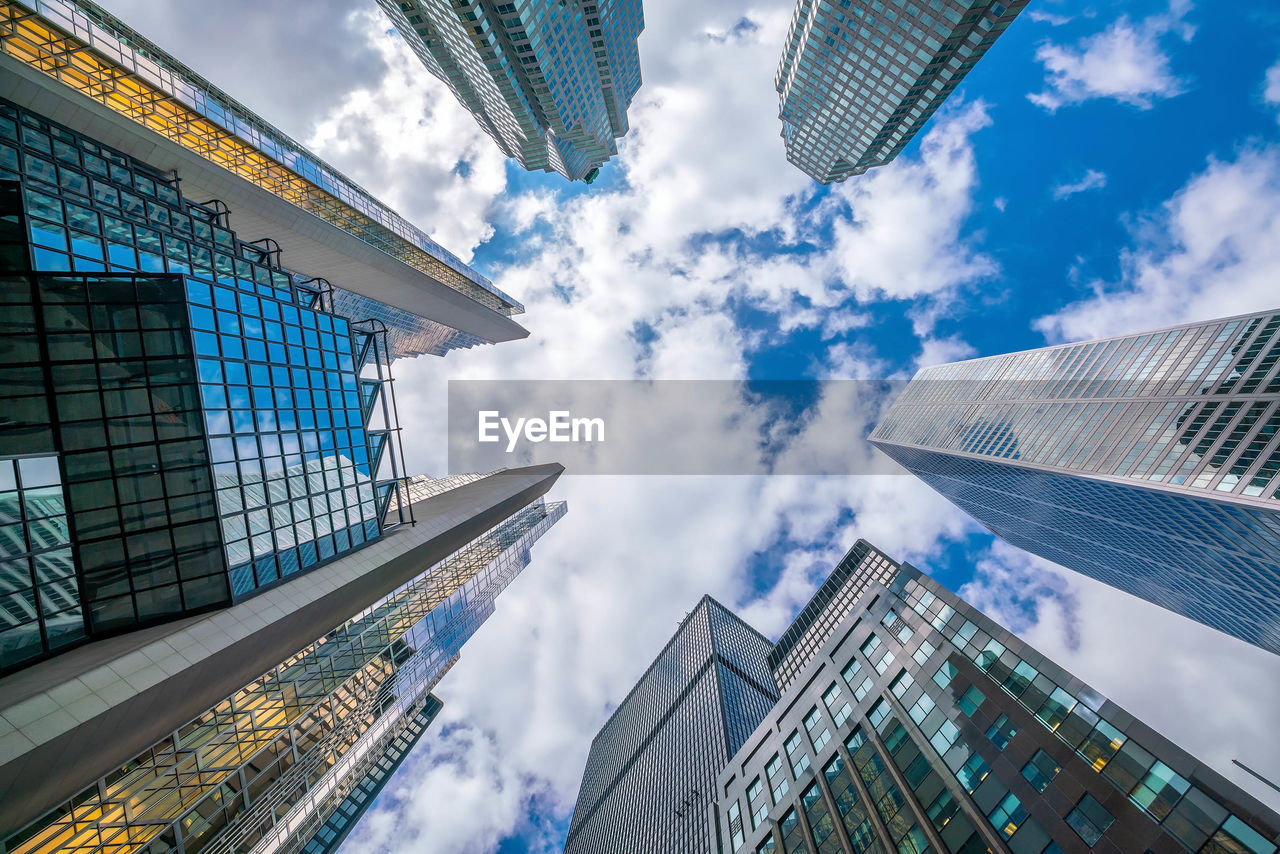 Directly below shot of modern buildings against sky