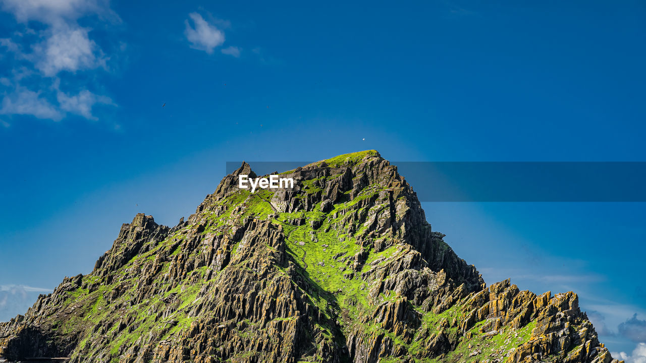 LOW ANGLE VIEW OF ROCKS AGAINST SKY