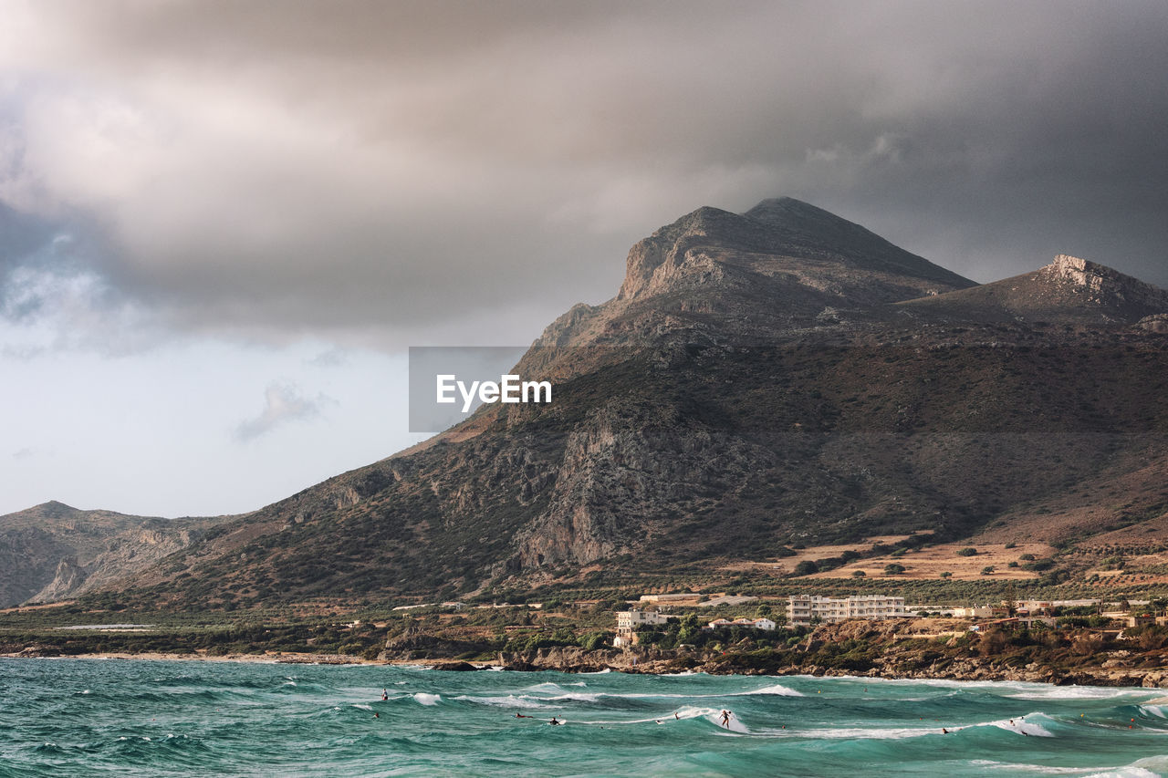 Scenic view of sea and mountains against sky in crete phalasarna