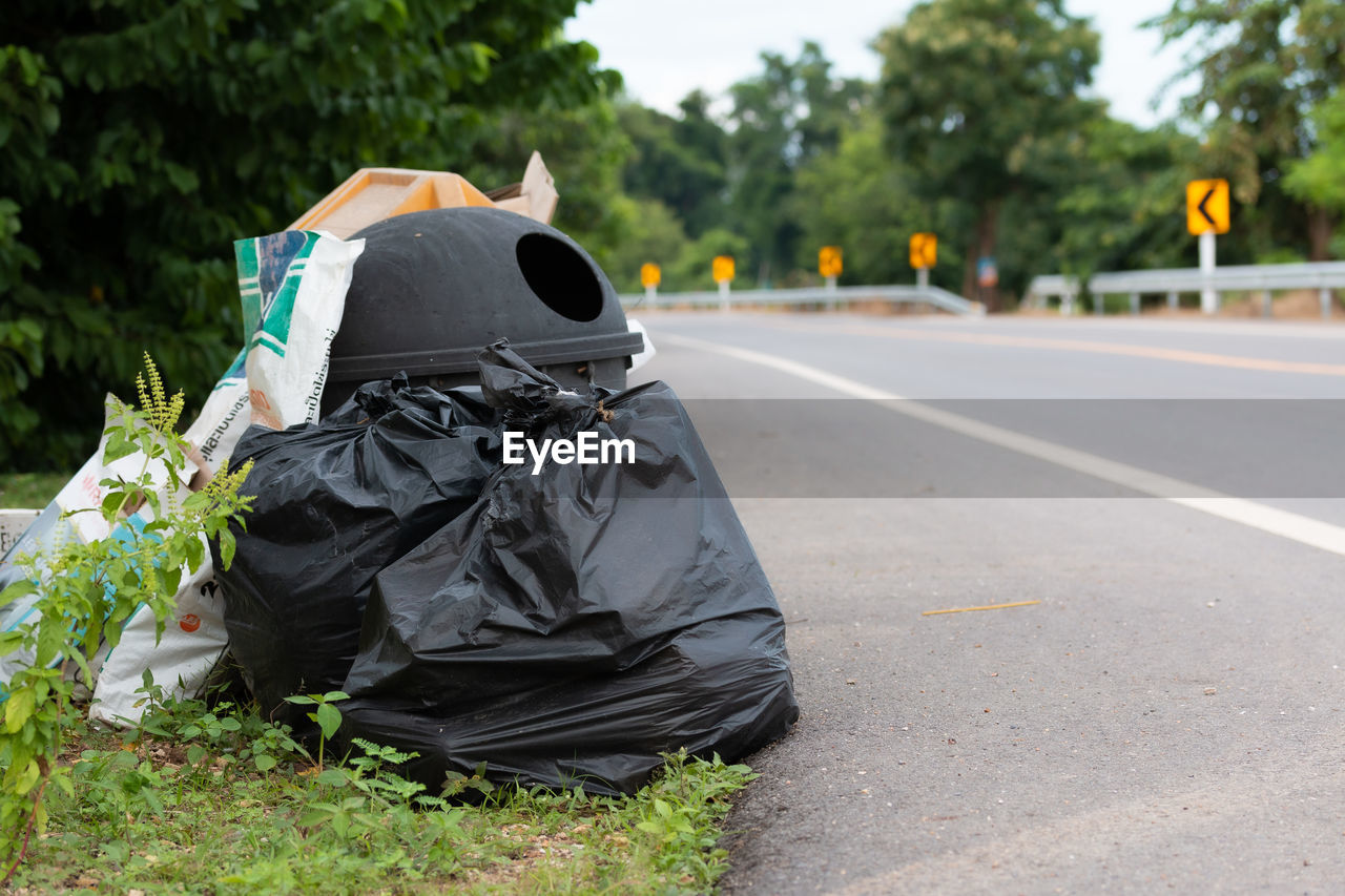 GARBAGE CAN ON ROAD