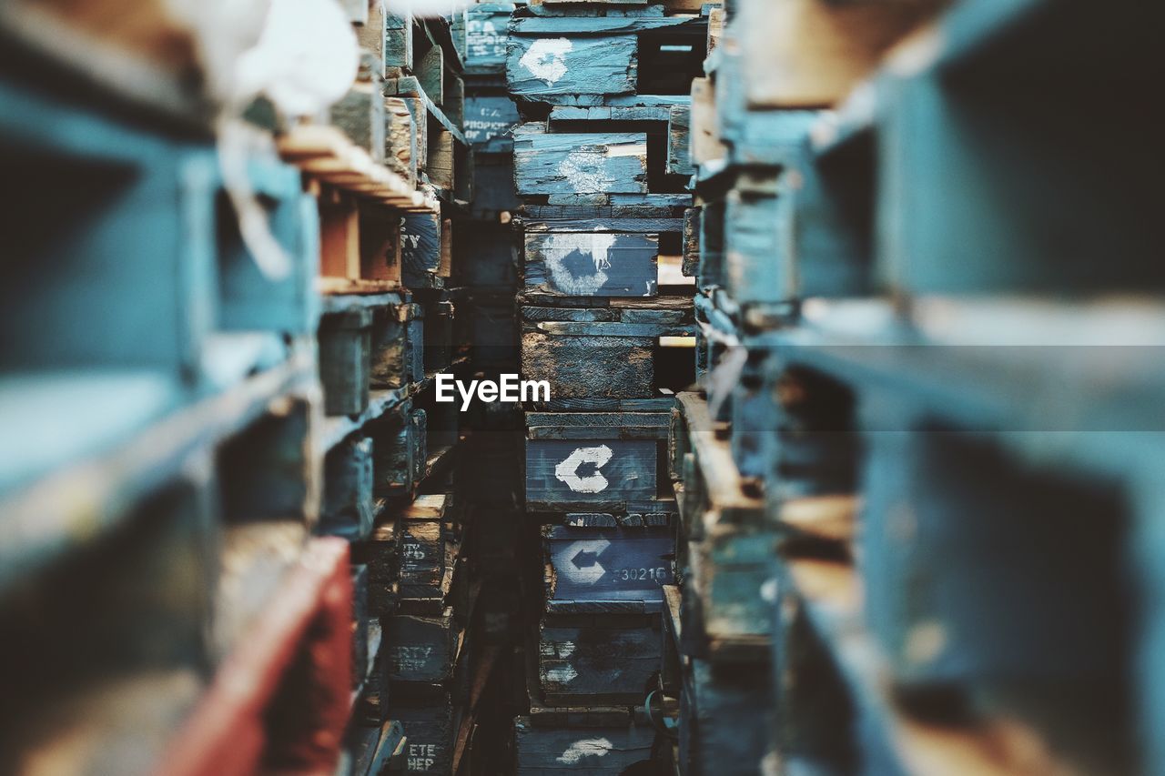 Close-up of empty wooden shelves in rows