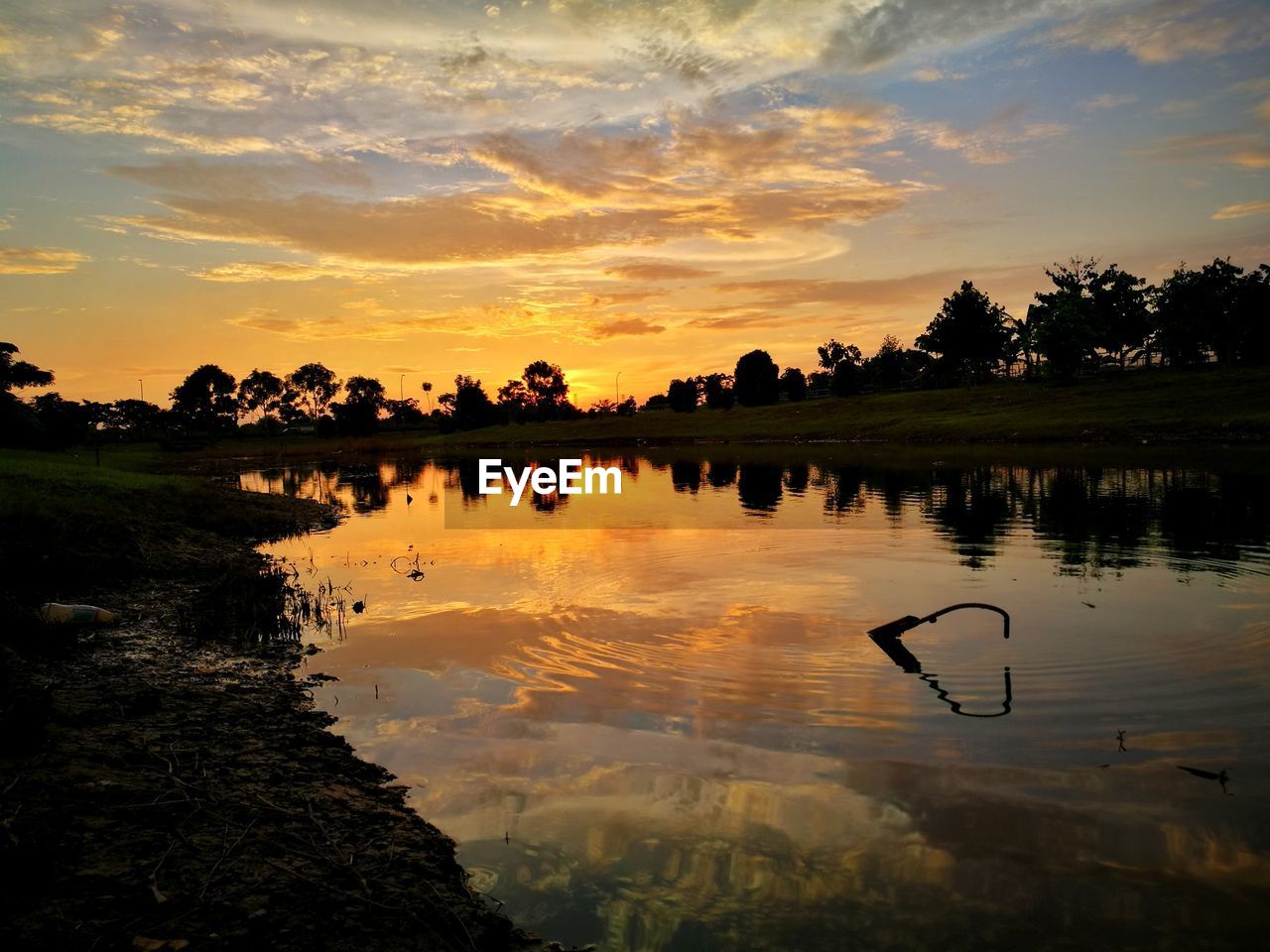 SCENIC VIEW OF LAKE DURING SUNSET