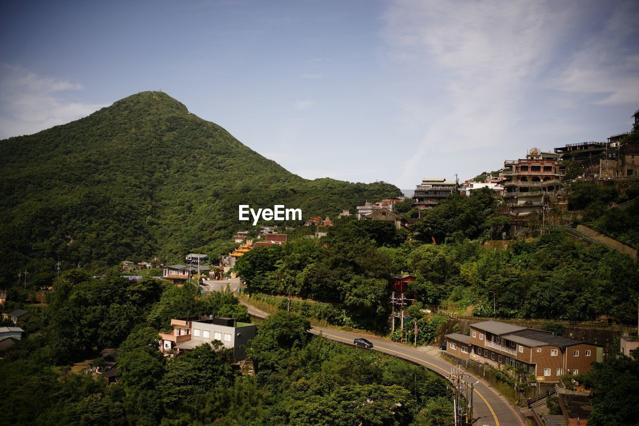 High angle view of buildings in city against sky