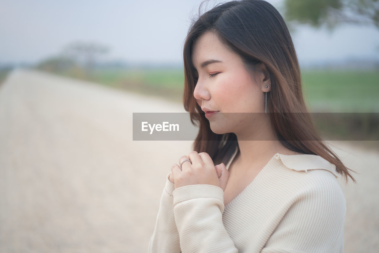 Portrait of beautiful woman standing outdoors