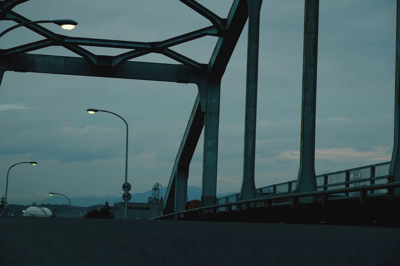 Surface level of road on bridge against the sky