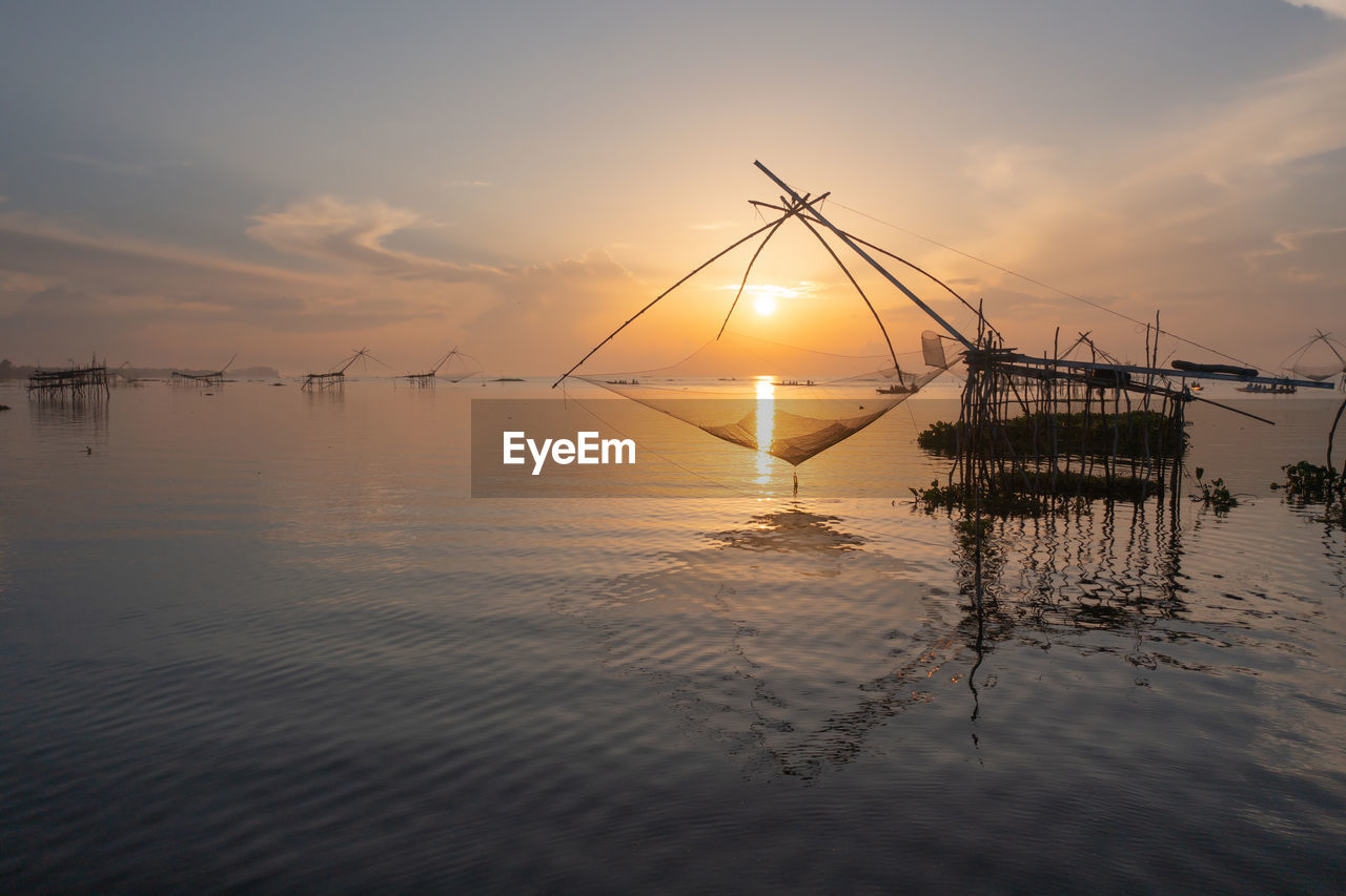 VIEW OF FISHING NET AT SUNSET