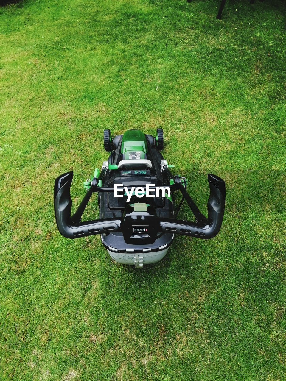 grass, plant, green, high angle view, vehicle, field, nature, day, lawn, lawn mower, land, mower, mode of transportation, no people, outdoors, growth, transportation, land vehicle, sports, go-kart, motorcycle