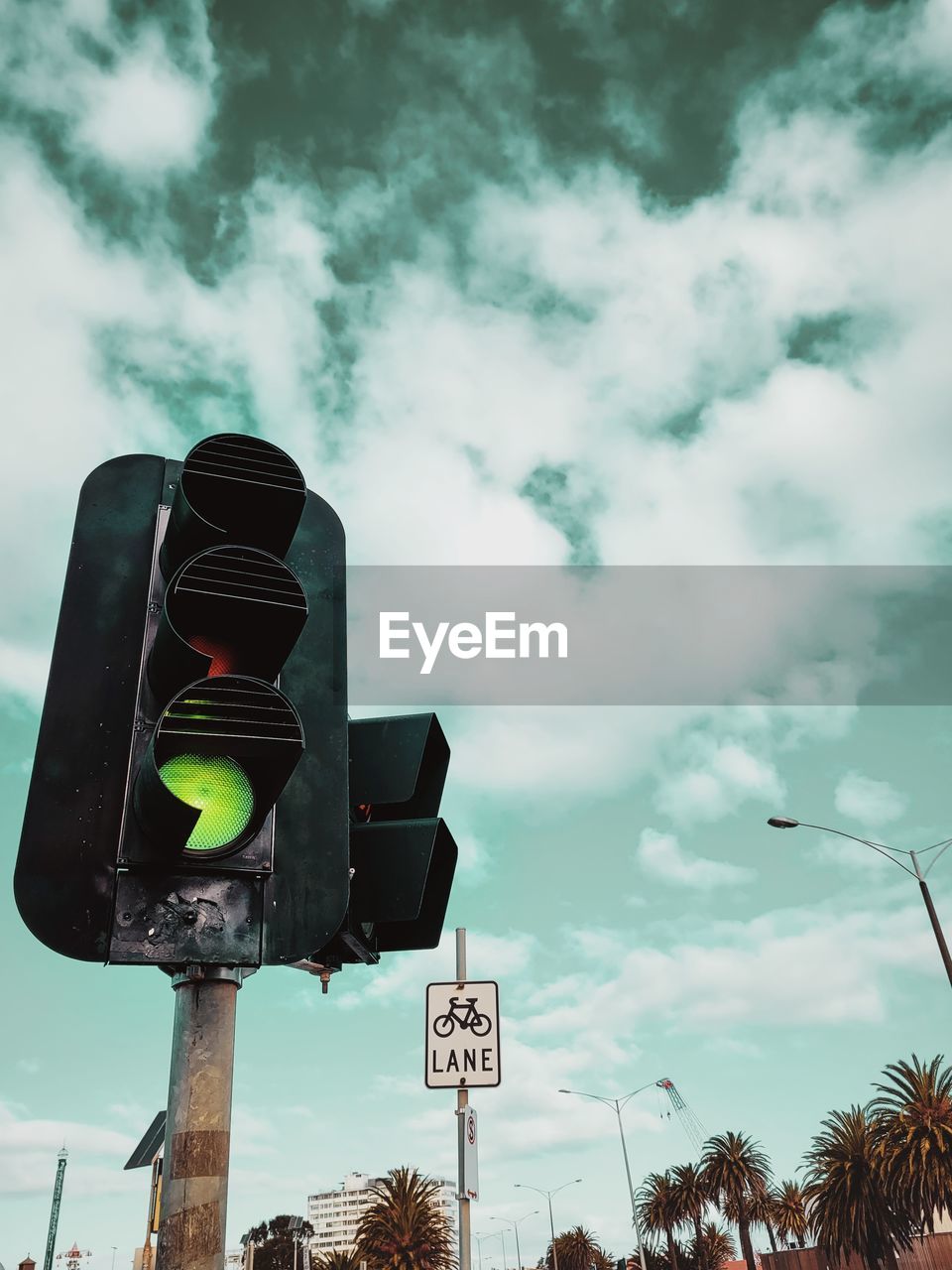 Low angle view of road sign against sky