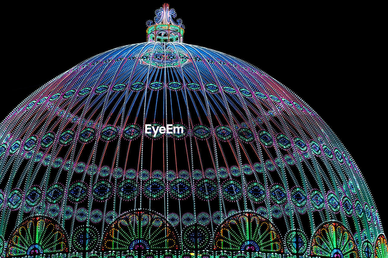 Low angle view of illuminated dome at night