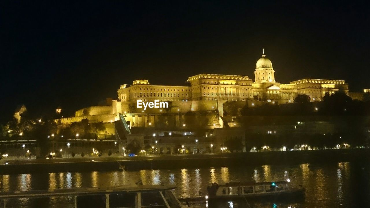 VIEW OF ILLUMINATED BUILDINGS AT NIGHT