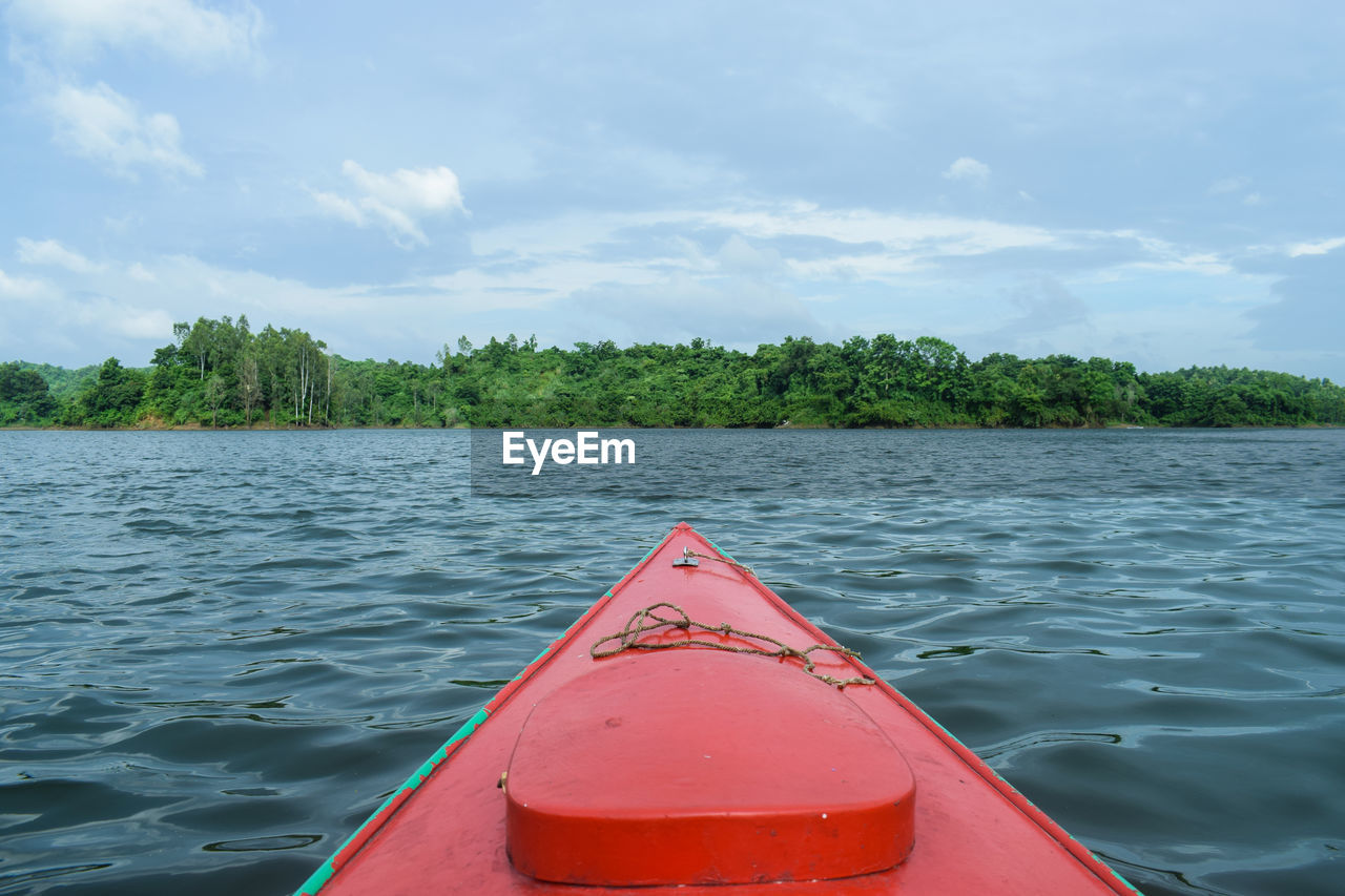Scenic view of lake against sky, kayaking on the lake