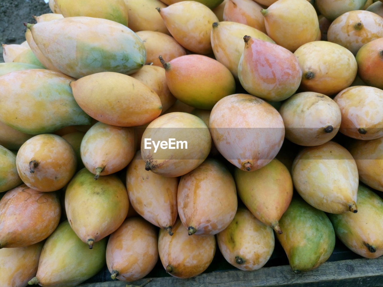 Directly above shot of mangoes at market for sale