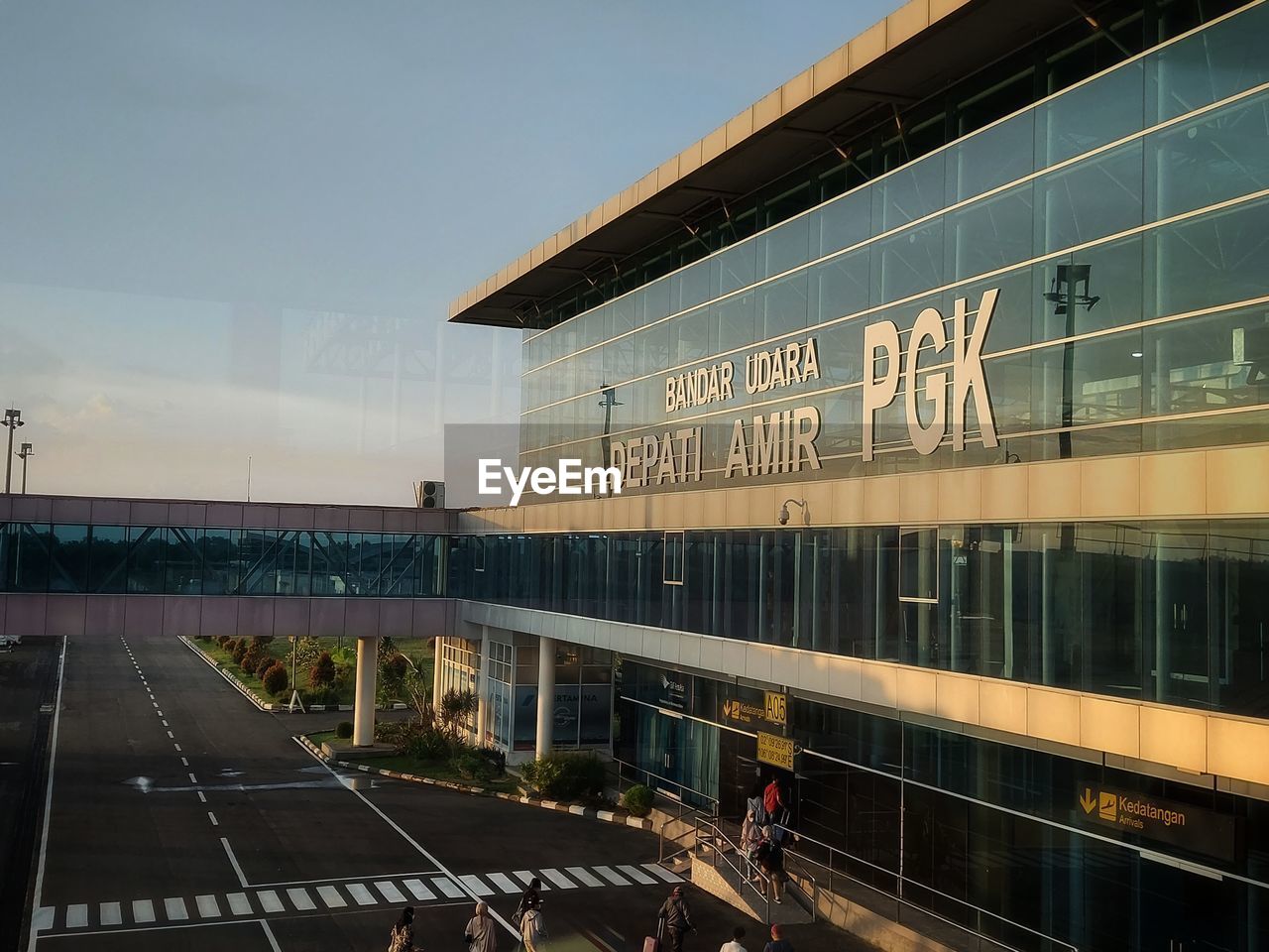 architecture, transportation, built structure, building exterior, city, travel, mode of transportation, sky, sport venue, metropolitan area, stadium, urban area, transport, rail transportation, railroad station, convention center, nature, travel destinations, road, public transport, outdoors, building, sign, business, group of people