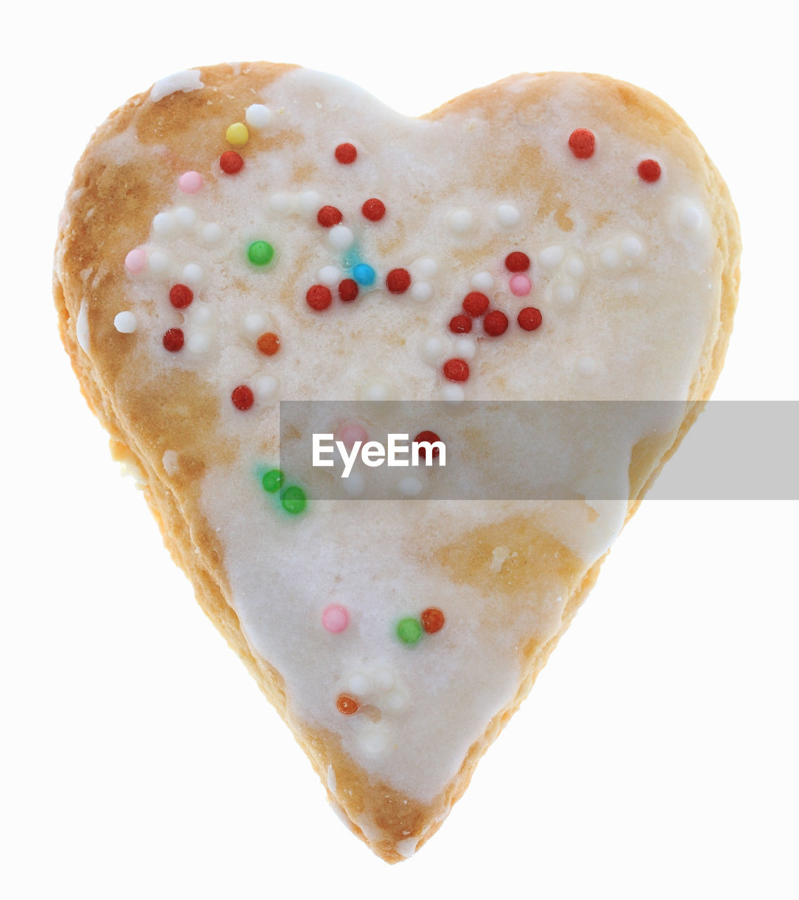 Close-up of heart shape cookie against white background