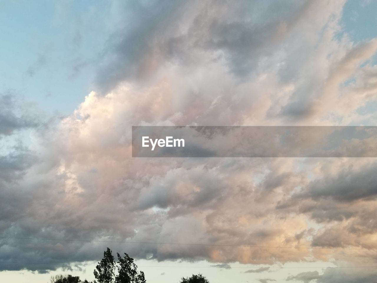 LOW ANGLE VIEW OF STORM CLOUDS OVER SKY