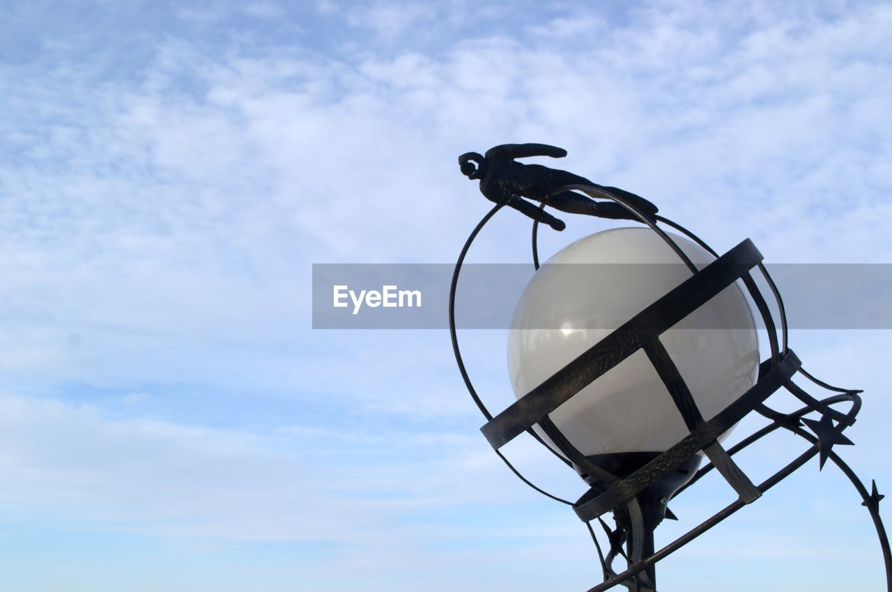 LOW ANGLE VIEW OF CRANE AGAINST THE SKY