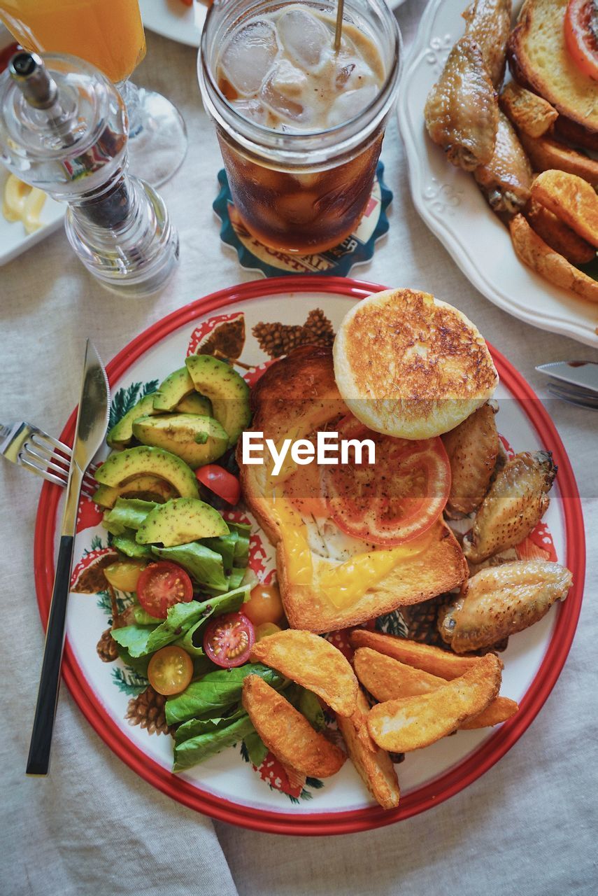 HIGH ANGLE VIEW OF MEAL SERVED IN PLATE ON TABLE