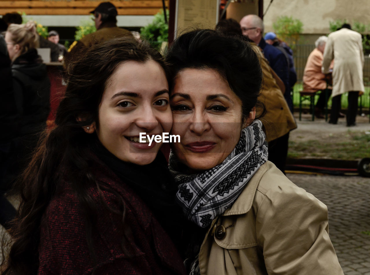 Portrait of smiling young woman with mother