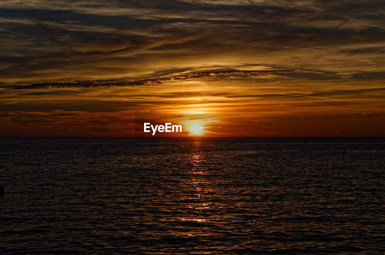 Scenic view of sea against sky during sunset