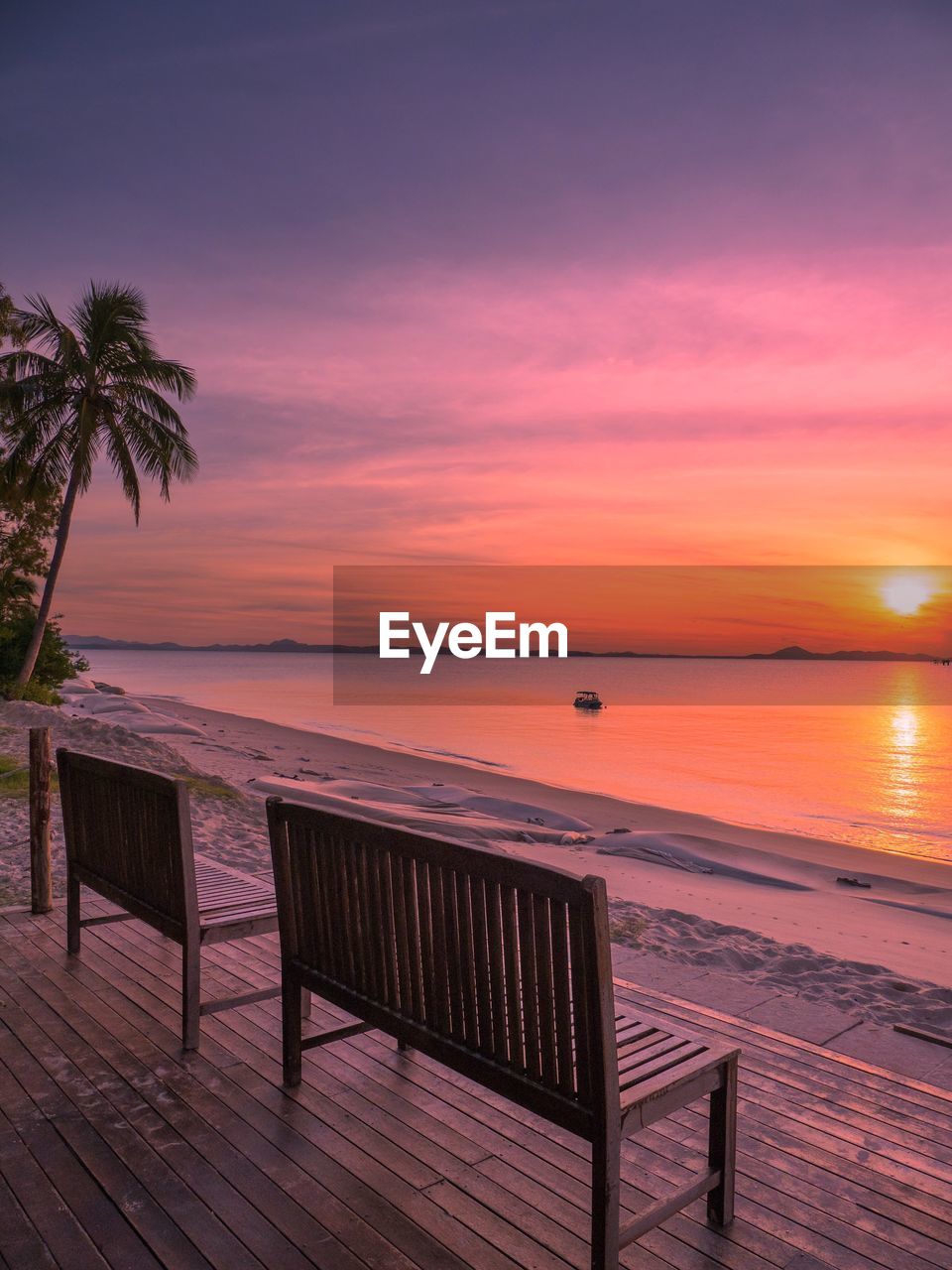 SCENIC VIEW OF BEACH AT SUNSET