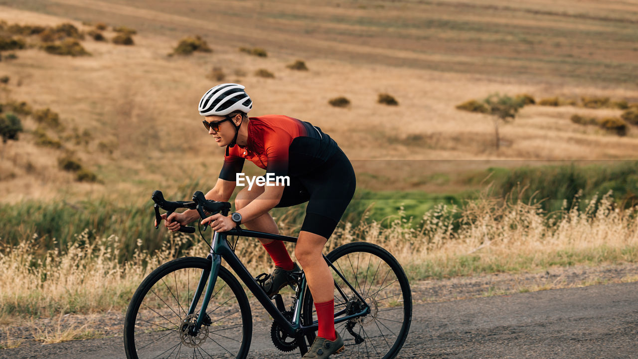 Man riding bicycle on road