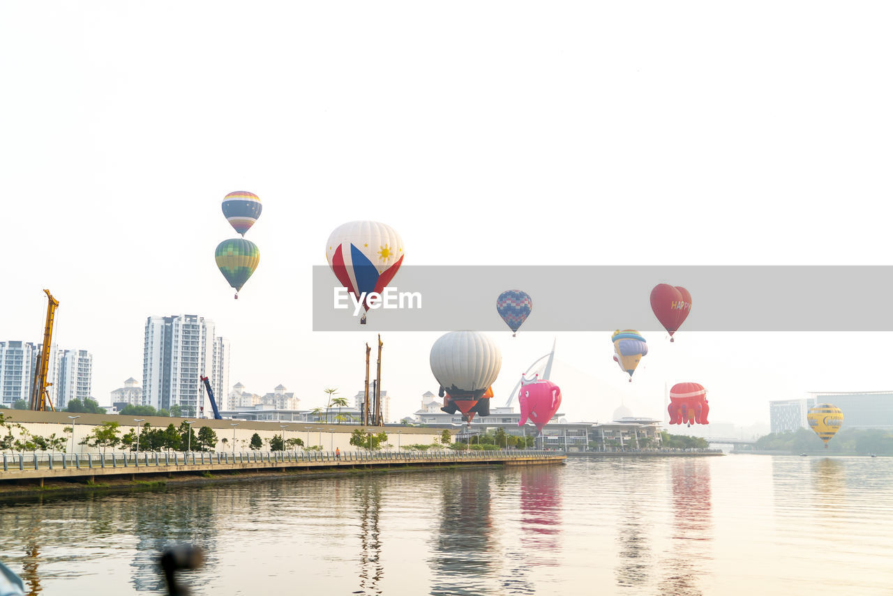 MULTI COLORED HOT AIR BALLOON IN WATER