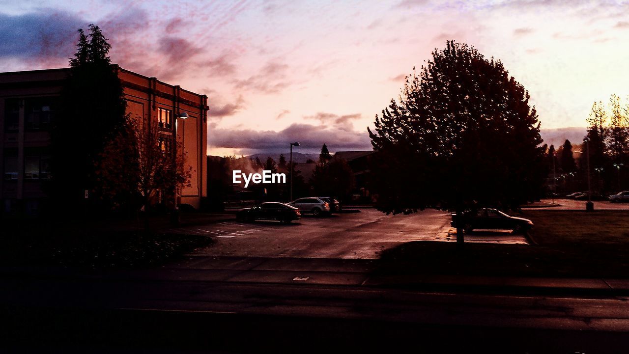 VIEW OF BUILDING AT SUNSET