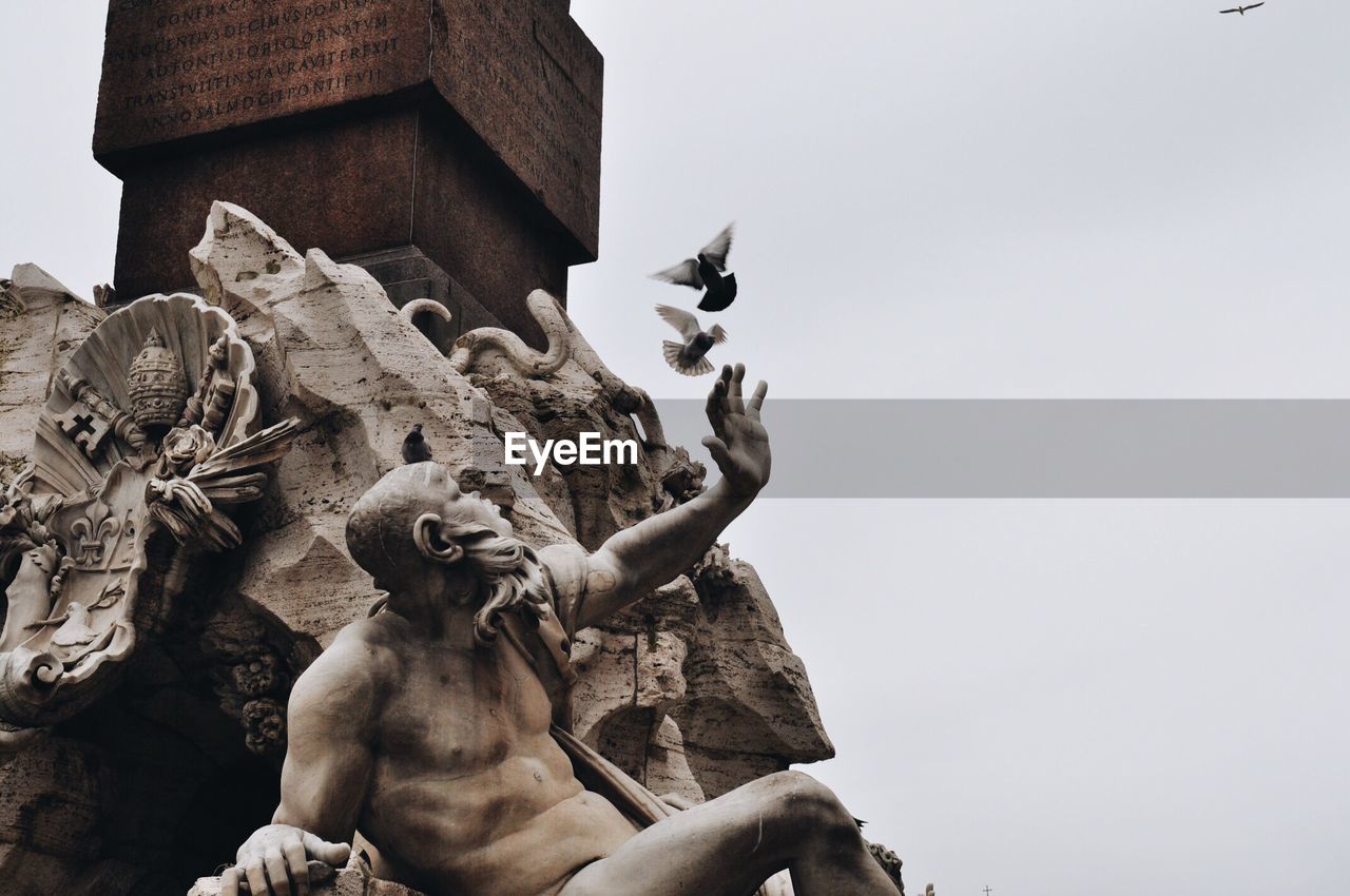 Low angle view of statue against clear sky