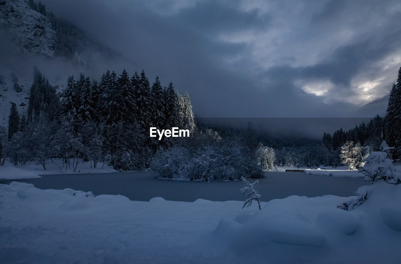 SNOW ON FIELD AGAINST SKY