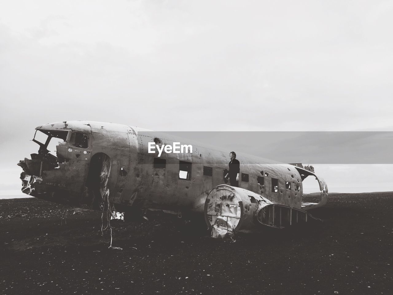 Abandoned airplane against sky