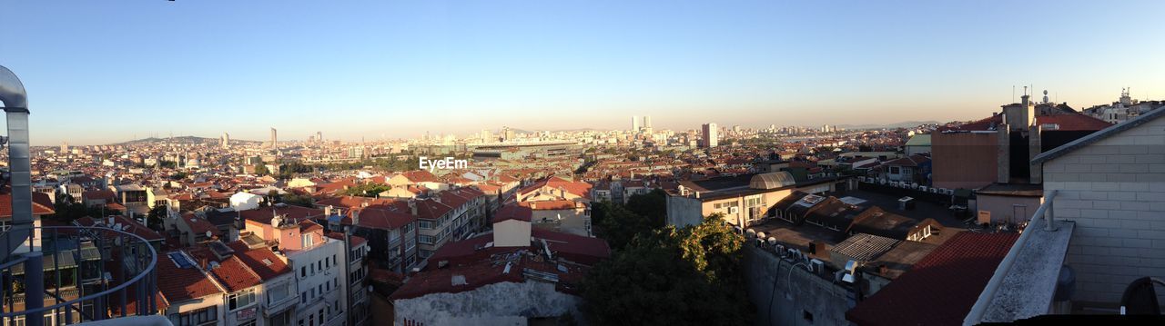 VIEW OF CITYSCAPE AGAINST BLUE SKY