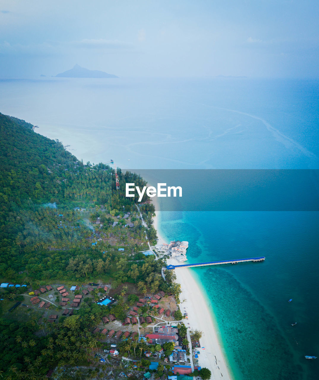 high angle view of sea and buildings against sky