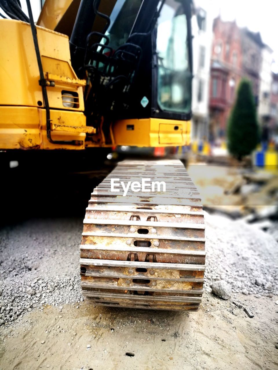 CLOSE-UP OF YELLOW CONSTRUCTION SITE ON ROAD