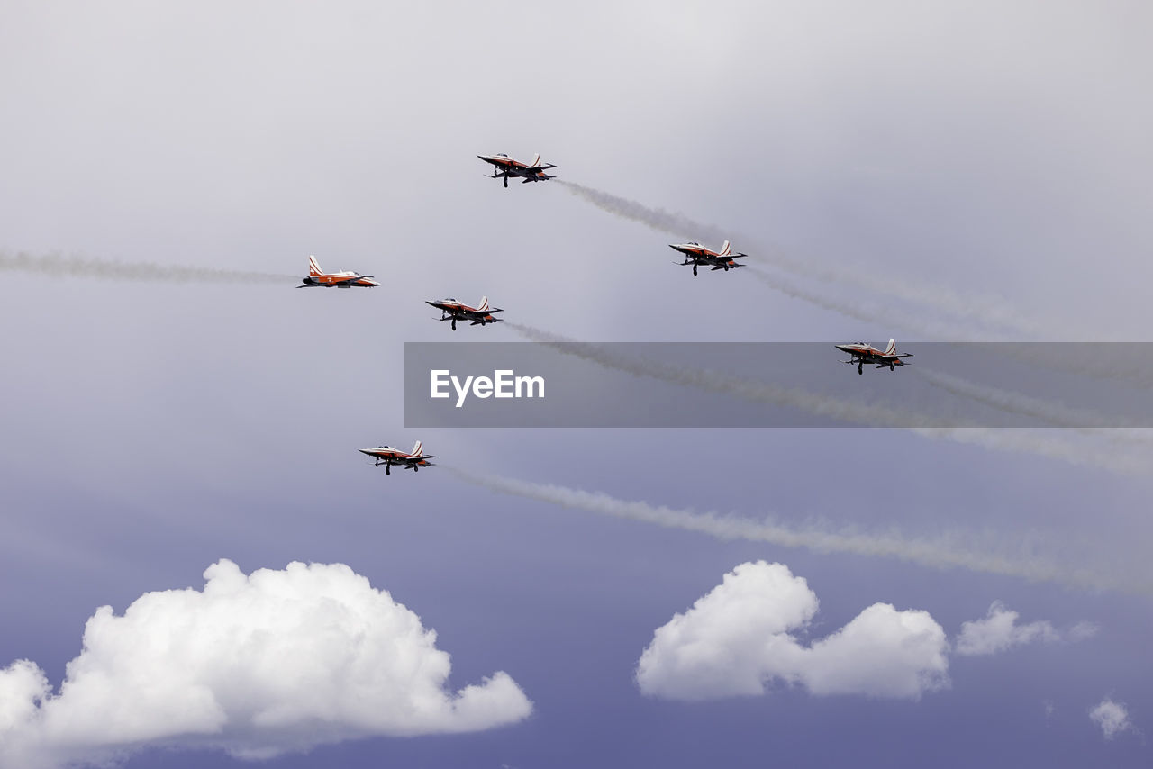 cloud, airplane, air vehicle, flying, transportation, mode of transportation, sky, air show, on the move, teamwork, aviation, cooperation, nature, air force, military, vehicle, smoke, aircraft, plane, motion, wing, fighter plane, vapor trail, no people, day, military airplane, arrangement, outdoors, mid-air, army, group of objects, accuracy, aerobatics, speed, low angle view