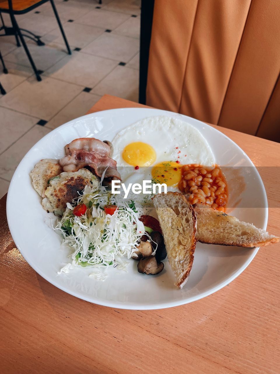 food, food and drink, plate, meal, dish, healthy eating, table, lunch, fried egg, wellbeing, freshness, cuisine, vegetable, indoors, meat, breakfast, no people, egg, high angle view, fried, brunch, dinner, business, restaurant, bread, serving size, produce, rice - food staple