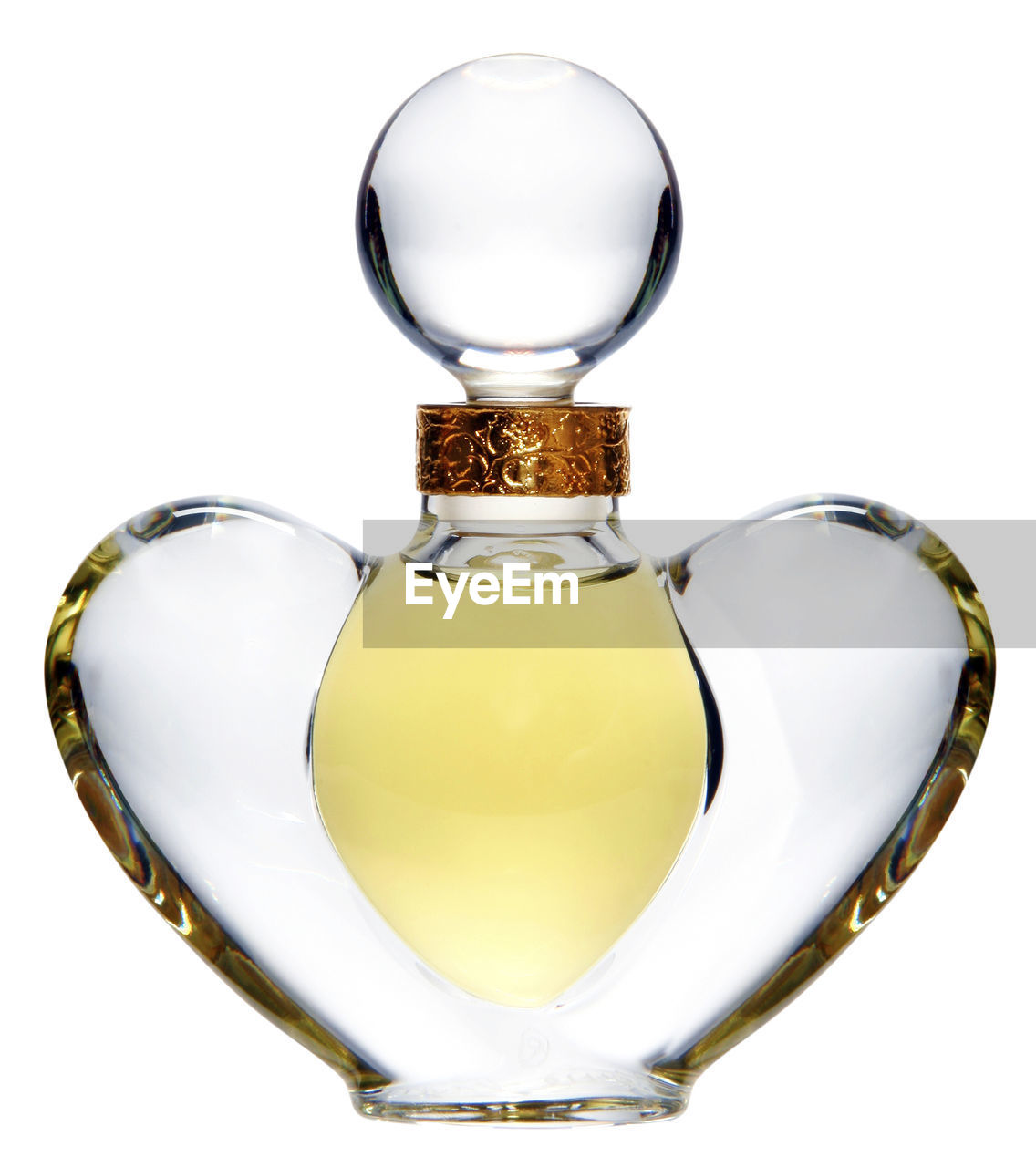 Close-up of perfume bottle over white background