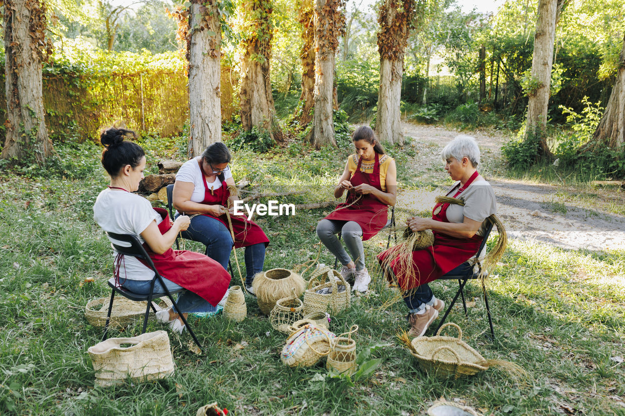 Artisans working with esparto grass in garden